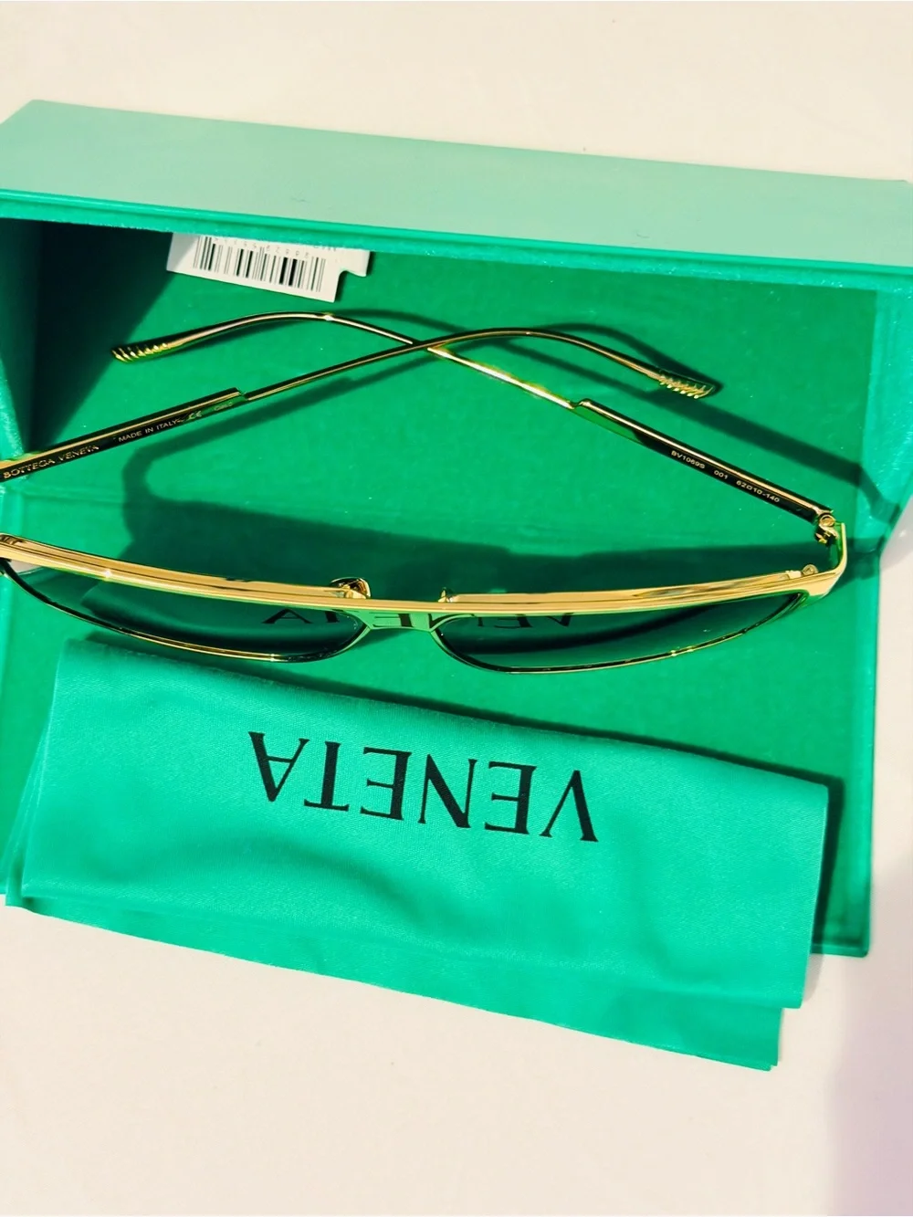 Bottega Veneta Gold Metal Frame Sunglasses with Dark Lenses